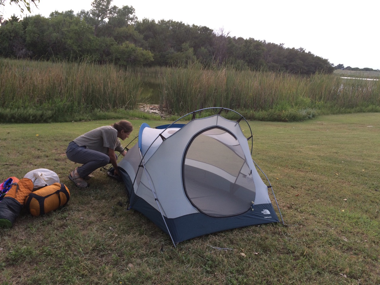 A simple portable tent home felt like an airy burrow! Here's Sandra setting up the tent at Black Kettle National Grasslands in Oklahoma.