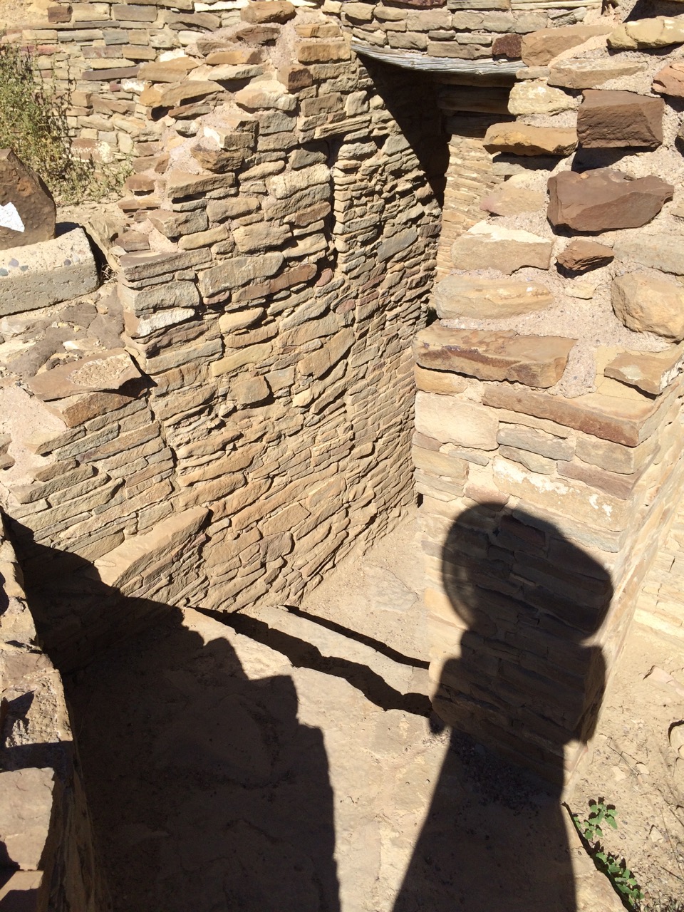 My shadow falls upon the stones as I explore Pueblo Bonito again--38 years later.